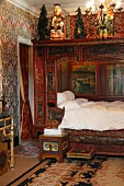Indian-inspired bedroom with alcove bed