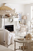 White living room with fireplace and collection of sculptures