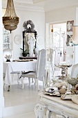 Eclectic collection of objet in white dining room