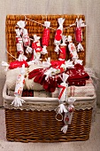 Basket containing winter clothing and an advent calendar