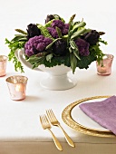 Table Centerpiece Made from Purple Artichokes and Cauliflower
