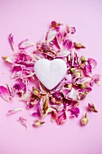 Heart lying in dried rose petals