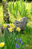 Stone figure as garden bench