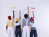 Group of friends about to paint wall.