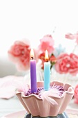 Candles decorating table set for birthday party