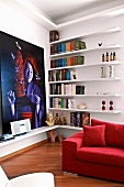 Minimalist shelving next to large contemporary painting in corner of modern living room