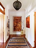 Hallway with decorative elements in warm earthy tones and ethnic patterns