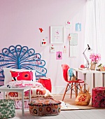 Young girl's room with bed, floor pillows and writing desk
