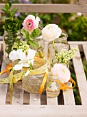 Spring flowers in old jam jars