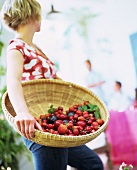 Lady with a large fruit basket