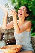 Woman washing outdoors