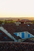 View of horizon across roofs of small French village
