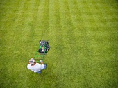 A man mowing grass