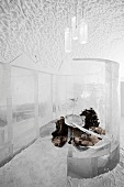 Seating area with reindeer skins in bar made of ice