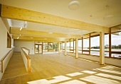 Spacious hall with wooden beams and ramp