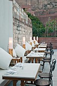 Set, outdoor tables in restaurant of Raas Haveli Hotel, Jodhpur, India