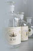 Empty apothecary's bottles with labels