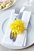 Napkin ring decorated with tissue paper pompom