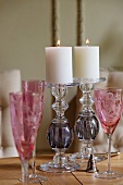 Pink champagne flutes and glass candlesticks