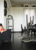 Dining room design with black chairs and zebra pattern carpet