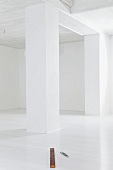 Empty white room with spirit level on floor