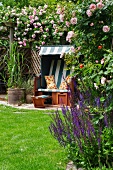 Wicker beach chair in rose garden