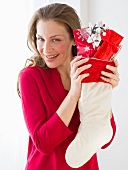 Woman holding Christmas stocking