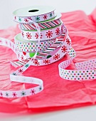 Stack of colorful ribbons on wrapping paper