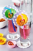 Paper cake cases decorating drinking glasses