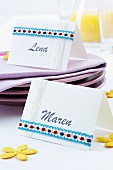 Hand-crafted name cards with ribbon trim