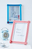 Picture frames decorated with ribbons and buttons