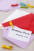 Invitation card with envelope and clothes peg