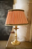 Table lamp on a mantelpiece