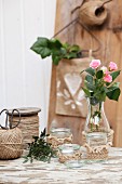 Trim hand-crocheted from jute yarn decorating simple jars and carafes