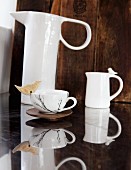 China jug, milk jug & teacup with bird ornament on rim