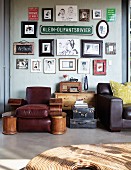 Leather armchair below collection of signs & pictures on wall