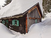 Snow-covered Alpine cabin
