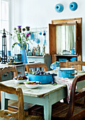 Country kitchen with blue accents and fresh plums