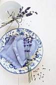 Lavender flowers and lavender bags on vintage plate