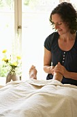 Woman giving a foot massage