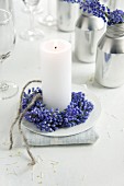 Candle with small wreath of grape hyacinths