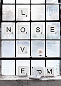 Scrabble letters: white foam squares with black letters decorating window