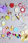 An assortment of party supplies for a birthday party (top view)