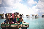 Children Playing at Back of Boat, Semporna, Borneo