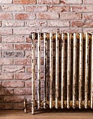 Vintage radiator on brick wall