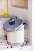 Stacked bottle tops stuck to lid of jewellery box as handle