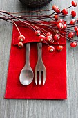Wooden cutlery and rosehips