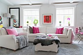 White, feminine interior with sparse accents of pink and red