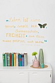 Wall decorated with motto & butterfly cut-out