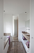 Bathroom with marble surfaces and tall radiator